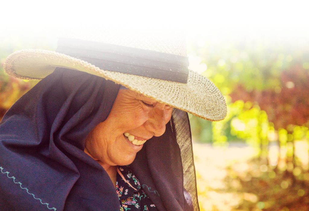Smiling woman wearing straw hat
